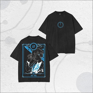 May include: Two black t-shirts with a faded appearance. One has a blue circular design on the front. The other displays a tarot card design on the back, outlined in blue, with the words "THE FOOL".