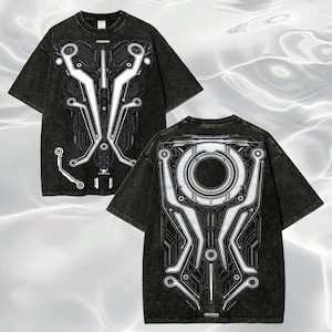 May include: A black acid-wash t-shirt featuring a white graphic print of a circuit board pattern on the front and a large circular mechanical design on the back. The shirt has short sleeves, a crew neckline, and a detailed technical aesthetic.