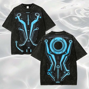 May include: A black acid-wash short-sleeve t-shirt featuring a bright blue circuit board graphic on the front and back. The front design displays vertical lines and nodes, while the back design showcases a large central circle with connected circuitry.