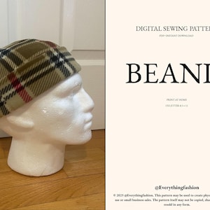 May include: A beanie hat with a plaid pattern in tan, black, and red, displayed on a white mannequin head. The image also includes text that reads "BEANIE" and "DIGITAL SEWING PATTERN".