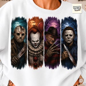 May include: A white sweatshirt featuring a graphic print of four horror movie characters in vertical panels. The design includes a hockey-masked figure with a machete, a clown holding a red balloon, a scarred figure with clawed gloves, and a masked figure holding a knife. The text "ILLUSTRA HAUS" appears in the top right corner.