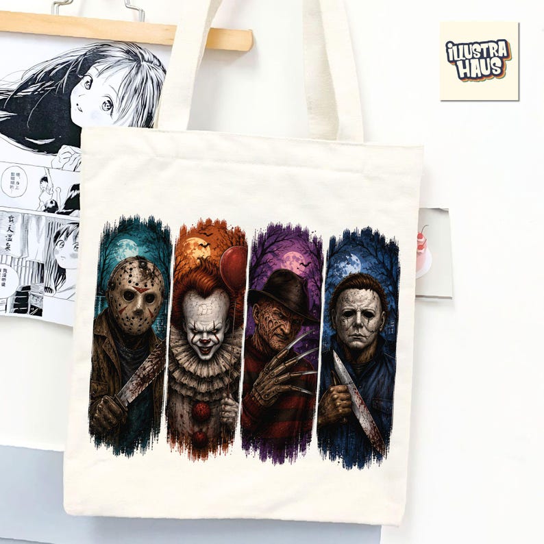May include: A cream-colored canvas tote bag featuring a graphic print of four horror movie characters arranged in vertical panels. The design includes a hockey-masked figure, a clown with a red balloon, a scarred figure with clawed gloves, and a masked man.