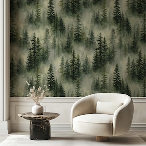 May include: A room featuring a forest-themed wallpaper with a repeating pattern of green pine trees in a misty setting. A cream-colored swivel chair and a marble-topped side table with a black base are in the foreground. A white vase holds dried flowers.