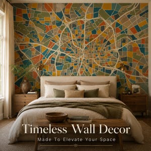 May include: A bedroom featuring a large, colorful map-themed wall mural. The mural is composed of geometric shapes in shades of blue, orange, yellow, and green. The bed is made with neutral-toned bedding and pillows, with a wooden bench at the foot of the bed. The text "Timeless Wall Decor" is displayed.