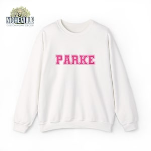 White Gildan 18000 sweatshirt with pink varsity PARKE text embroidery style design, front view studio mockup showing personalized custom name sweatshirt, Nicheville custom sweatshi