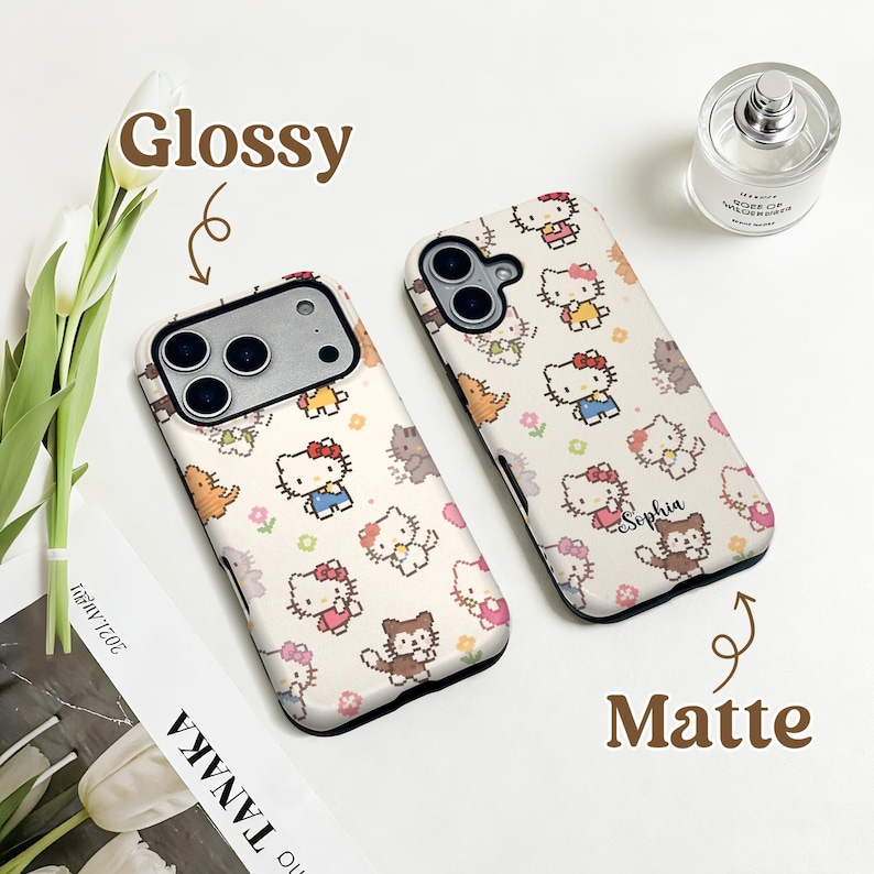May include: Two phone cases with a repeating pattern of cartoon characters, flowers, and animals. One case is labeled "Glossy" and the other "Matte". The cases are white with a variety of colorful characters. One case has the name "Sophia" printed on it.