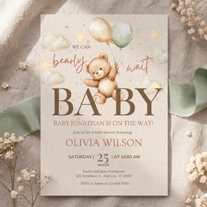 May include: Baby shower invitation with a teddy bear holding balloons. The invitation reads "We can bearly wait BABY" and includes the name "Olivia Wilson" and event details.