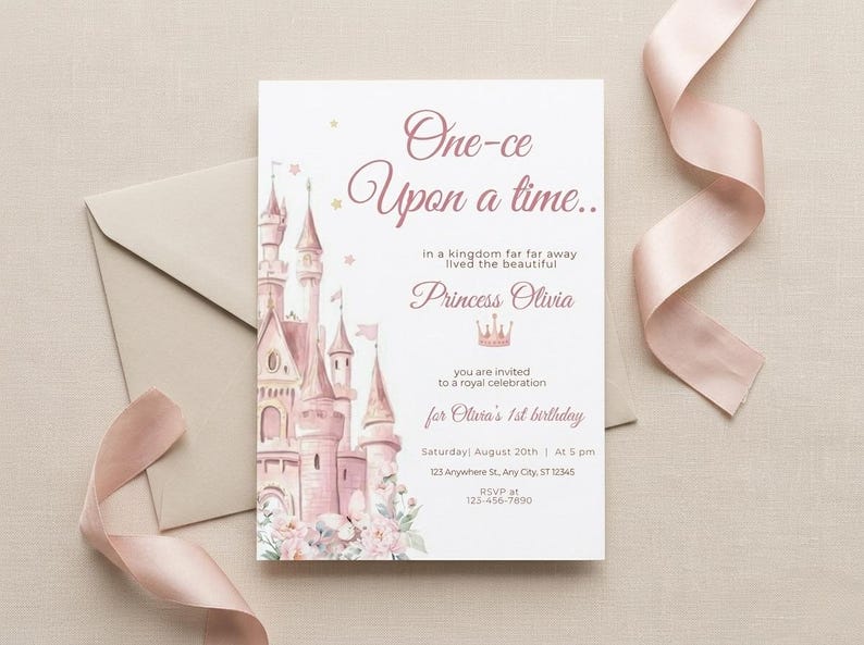 May include: A princess-themed invitation card with a watercolor castle illustration in shades of pink. The text reads "One-ce Upon a time..." and invites guests to a royal celebration for Olivia's 1st birthday. Includes date, time, and location.