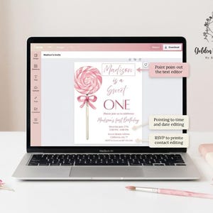 May include: A laptop displays a pink and white invitation design for a first birthday. The invitation features a lollipop graphic and the text "Madison is a Sweet ONE." Additional elements include a paintbrush, a notepad, and a decorative lollipop.