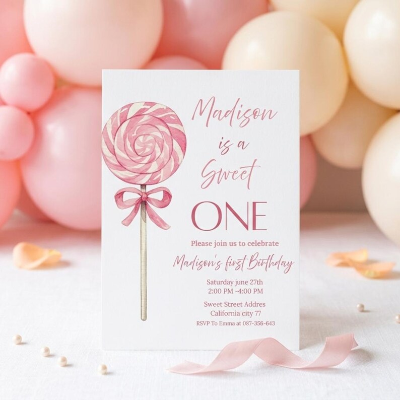 May include: A pink and white invitation card for a first birthday celebration. The card features a watercolor illustration of a lollipop and the text "Madison is a Sweet ONE". Additional text includes the date, time, and location of the party.