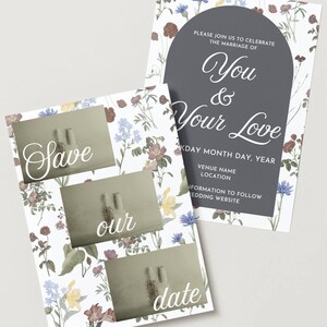 Könnte beinhalten: Hochzeitseinladungs-Set mit floralen Mustern und den Worten "Save our date". Die Haupteinladung hat einen dunkelgrauen Bogen mit den Worten "You & Your Love". Das Set enthält Hochzeitsdetails.
