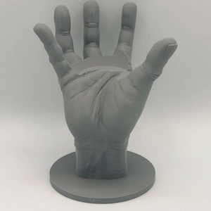 May include: A handmade wooden sign with the text "Welcome to our home" in a handwritten style. The sign is painted white with black lettering and a distressed finish, perfect for home decor.