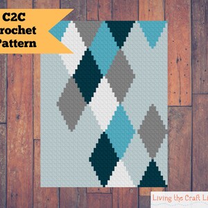Op de afbeelding: C2C haakpatroon met een ruitpatroon in tinten blauw, grijs, wit en zwart.
