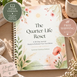 May include: A spiral-bound journal titled The Quarter-Life Reset, A 30-Day Journal Ready to Embrace Your True Selves, Summer Solstice Edition. The cover features watercolour illustrations of pink flowers and green leaves on a white background.