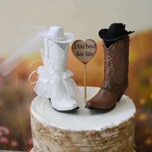 western wedding cake topper cowboy cowgirl boots bride and groom country rustic wedding decorated boots Just Hitched sign country bride