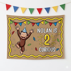 May include: A brown banner with a cartoon monkey wearing a party hat, celebrating a second birthday. The banner reads "Nolan is 2 Curious" in yellow and white text, with a yellow border and colorful bunting.