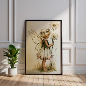 May include: A framed wall art print featuring a watercolour illustration of a small fairy with translucent wings, wearing a petal-shaped dress and a flower crown, standing in a field while holding two large white daisy flowers on long stems.