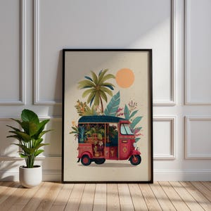 May include: A framed art print depicting a red tuk-tuk, decorated with plants and flowers, set against a backdrop of tropical foliage, a palm tree, and a sun. The artwork is framed in a black border and displayed on a light beige background.
