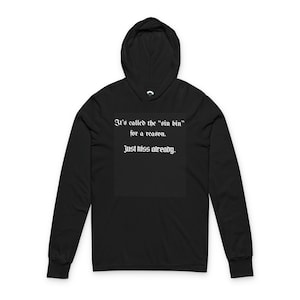 May include: Black hooded sweatshirt with the text "It's called the 'sin bin' for a reason. Just kiss already." in a gothic font. The long-sleeved top has a hood and is made of a soft material.