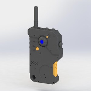 May include: A futuristic-looking, dark gray device with a prominent antenna. It features a blue circular element, several buttons, and yellow accents on the side. The design suggests a handheld communication or control device.