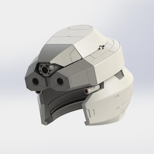 May include: A futuristic, two-tone helmet design in shades of gray and off-white. The helmet features a complex, angular construction with multiple circular openings and a prominent central lens. The overall aesthetic suggests a sci-fi or industrial theme.