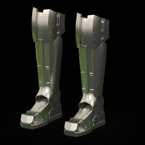 May include: A pair of metallic silver shin guards and boots featuring a segmented, industrial design with raised panels, vertical ridges, and a thick, treaded sole. The armor-like footwear extends to the knee with a rigid, structured appearance.