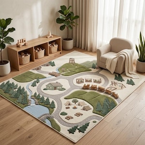 May include: A rectangular area rug featuring a textured, raised-pile landscape design with winding gray roads, green hills, a blue river, and forest motifs. The rug includes detailed illustrations of a cabin, tents, a train, and a lookout tower.