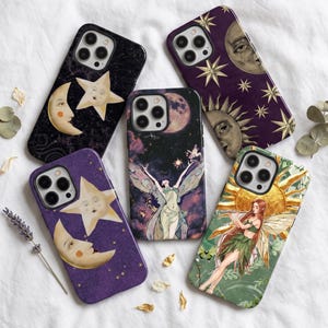 May include: Five smartphone cases featuring celestial and fantasy illustrations. Designs include a crescent moon with a face, stars, a winged figure reaching toward a moon, and a fairy with wings against a large golden sun on a green background.