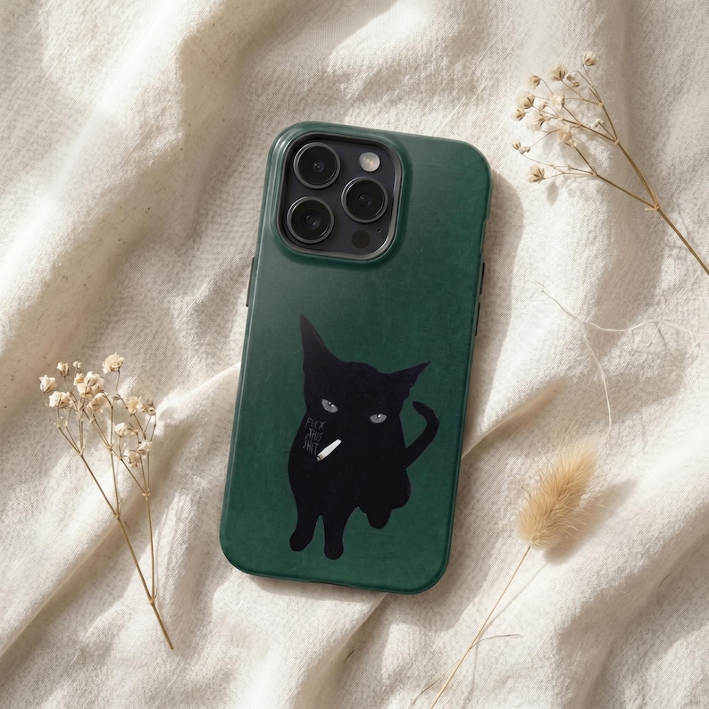 May include: A dark forest green smartphone case featuring a graphic illustration of a black cat with light-colored eyes. The cat is depicted with a white cigarette in its mouth and the text "FUCK THIS SHIT" printed in small white letters.