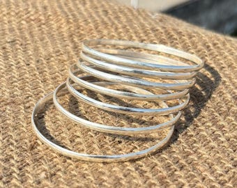 Set of 7 Silver Bangles – Minimalist Stackable Bracelets , wedding gift .