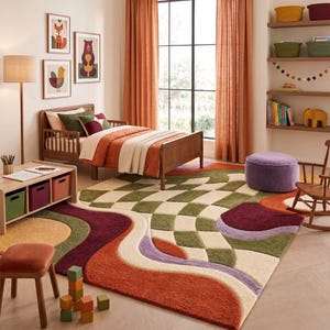 May include: A large rectangular area rug featuring a textured, multi-colored pattern of wavy lines and a checkered grid in shades of olive green, cream, burnt orange, deep burgundy, and soft lavender, covering the floor of a child's bedroom.