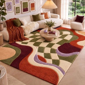 May include: A rectangular area rug featuring a tufted, high-pile texture with a geometric pattern of cream, olive green, burnt orange, deep burgundy, and lavender wavy lines and checkered blocks covering the entire surface of the floor covering.