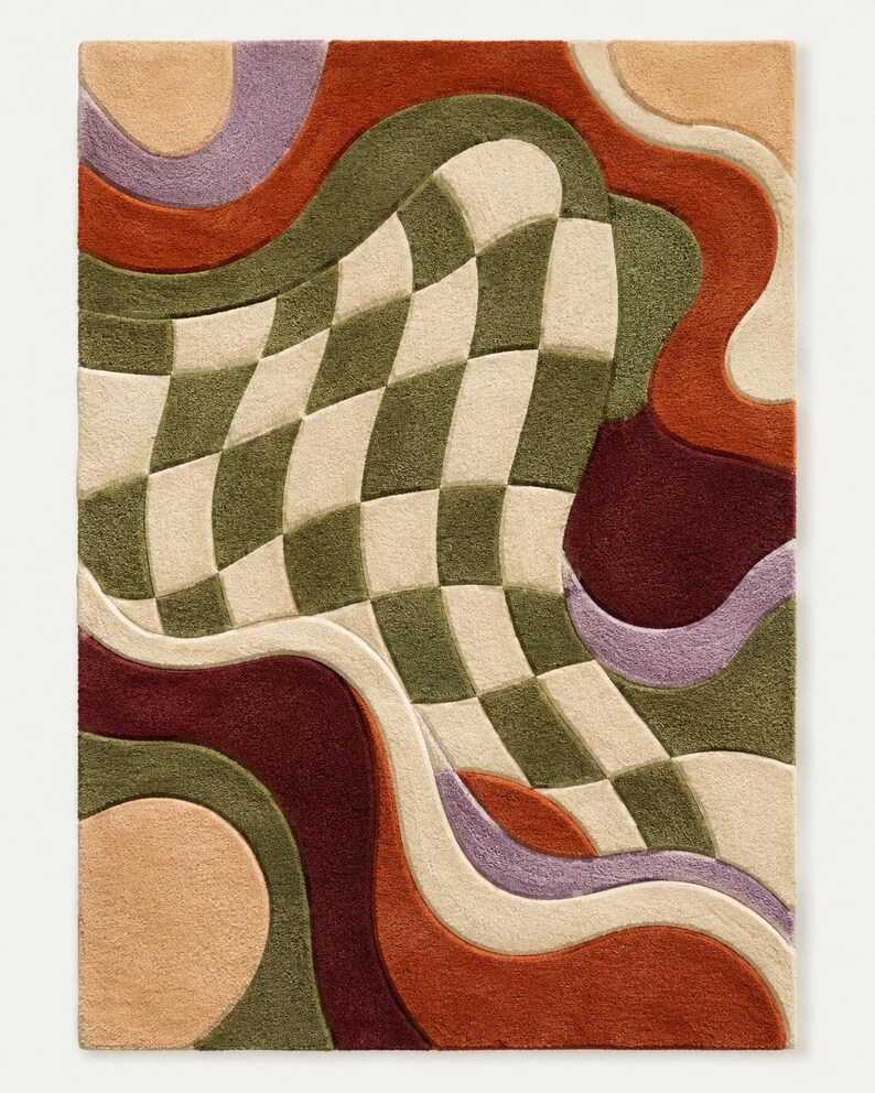 May include: A rectangular area rug featuring a tufted texture with a central warped checkerboard pattern in olive green and cream. The design includes flowing, organic shapes in shades of terracotta, deep burgundy, lavender, and soft peach.