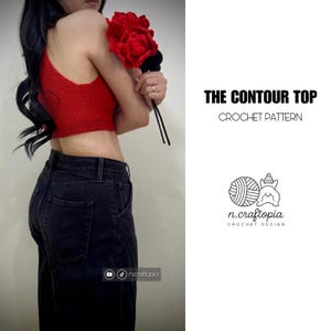 May include: A red crochet crop top with the text "THE CONTOUR TOP CROCHET PATTERN" and a logo. The top is paired with black jeans. The image also features a bouquet of red flowers.