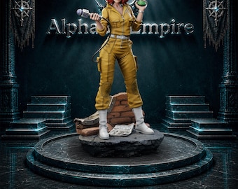 May include: A 3D printed resin figurine of a character with red hair wearing a yellow jumpsuit and white boots. The character holds a microphone in one hand and a small green object in the other, standing on a base with a newspaper and brick debris.