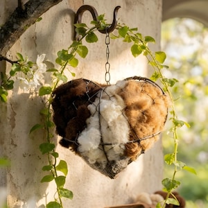 May include: A set of three ceramic nesting bowls in shades of blue, green, and white. The bowls feature a speckled glaze and a simple, modern design. The largest bowl measures approximately 6 inches in diameter.