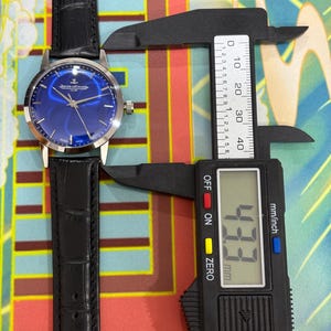 Jaeger-LeCoultre Club sunburst blue dial vintage Swiss mechanical dress watch