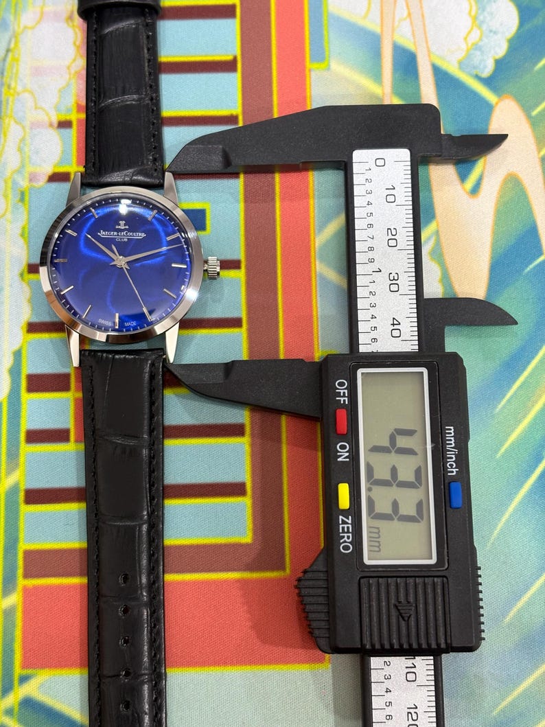 Jaeger-LeCoultre Club sunburst blue dial vintage Swiss mechanical dress watch