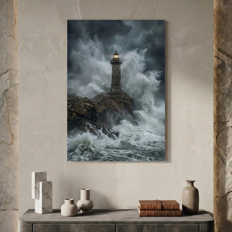 May include: A framed print of a lighthouse battling a stormy sea. The lighthouse, made of stone, stands on a rocky outcrop as large waves crash against it. The sky is dark and filled with dramatic clouds, creating a powerful coastal scene.