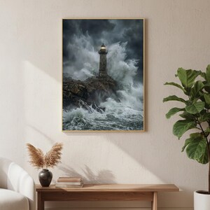 May include: A framed print of a lighthouse on a rocky island, battling a stormy sea. The lighthouse is gray, with a bright light at the top. The waves are white and foamy, crashing against the rocks. The sky is dark and dramatic.