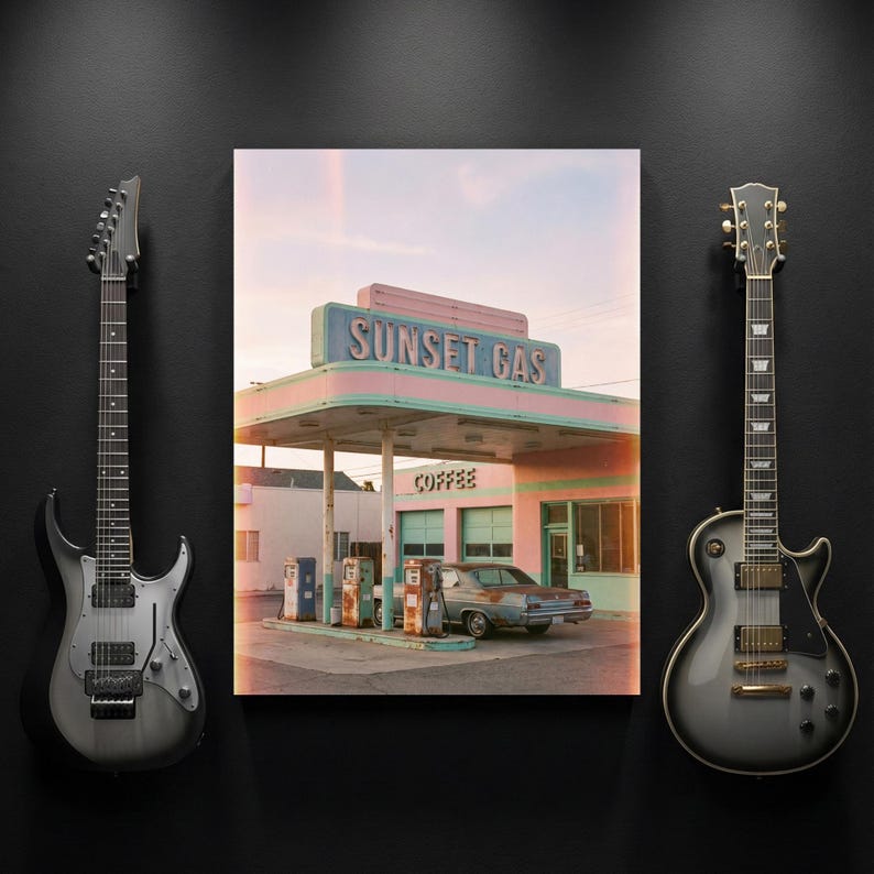 May include: A framed print of a vintage gas station with the text "Sunset Gas" in pink and blue. Two electric guitars flank the print on a black background. The gas station has a retro aesthetic.