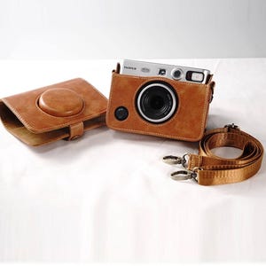 May include: A set of three ceramic mugs with a speckled, matte finish. The mugs are in shades of cream, light gray, and dark gray. Each mug has a simple, minimalist design, perfect for coffee or tea.