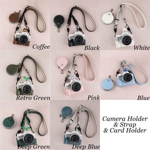 Puede incluir: Una colecci&oacute;n de fundas para c&aacute;maras en varios colores, cada una con una correa y un tarjetero a juego. Los colores incluyen caf&eacute;, negro, blanco, verde retro, rosa, azul, verde oscuro y azul oscuro. Tambi&eacute;n se ve el texto "Camera Holder & Strap & Card Holder".