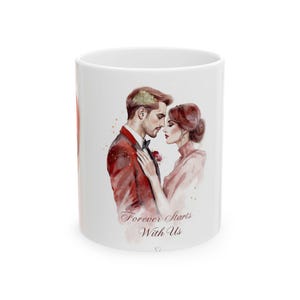May include: White ceramic mug featuring a watercolor illustration of a couple in formal attire. The man wears a red suit, and the woman wears a pink dress. The text "Forever Starts With Us" is written on the mug.