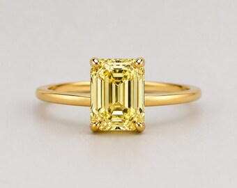 Ring met een 4-karaats, fraai geslepen, levendig gele, in het laboratorium gekweekte diamant, gezet in 10-karaats goud.