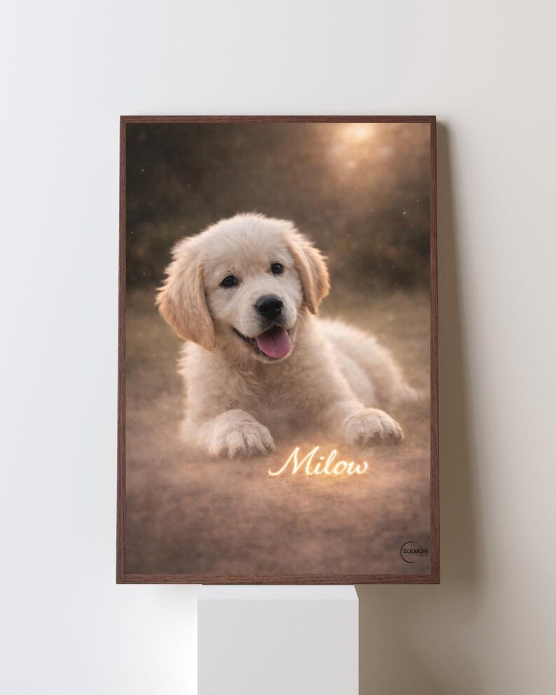 May include: A framed print featuring a Golden Retriever puppy lying down with its tongue out. The puppy has light-colored fur and the name "Milow" is written in cursive at the bottom. The frame is a dark brown color.