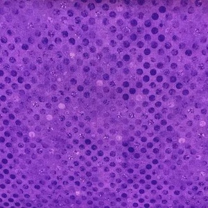 May include: A vibrant purple fabric featuring a repeating pattern of dark purple circular dots. The material has a subtle, shimmering, and reflective texture throughout, creating a multi-dimensional appearance across the entire surface of the textile.