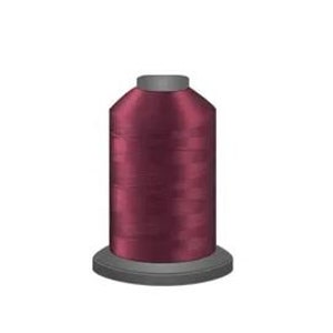 May include: A spool of deep burgundy colored thread.