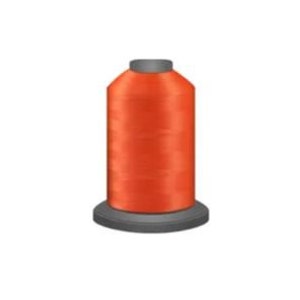 May include: A spool of bright orange thread for sewing or embroidery.