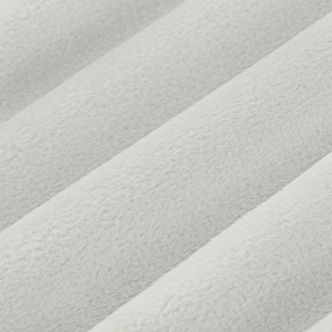 May include: Close-up of a soft, light gray fabric with a fuzzy texture. The fabric is folded in a way that creates a series of diagonal lines.